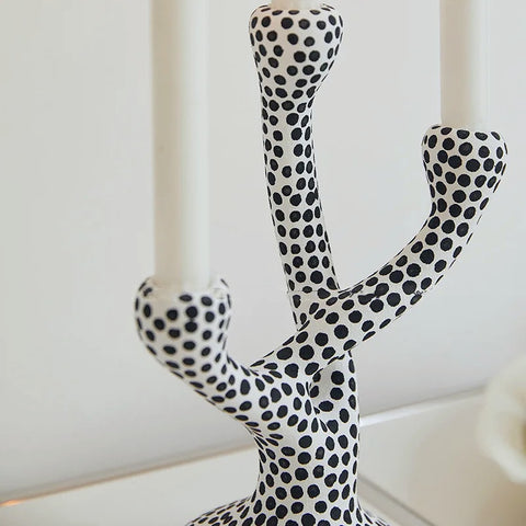 Whimsical Polka Dot Ceramic Candelabra by Allthingscurated combines abstract design with a touch of quirkiness, making it an aesthetically-pleasing piece for any modern and stylish homes. Perfect for lighting up your space with a touch of charm and personality; or as a decorative piece on its own.