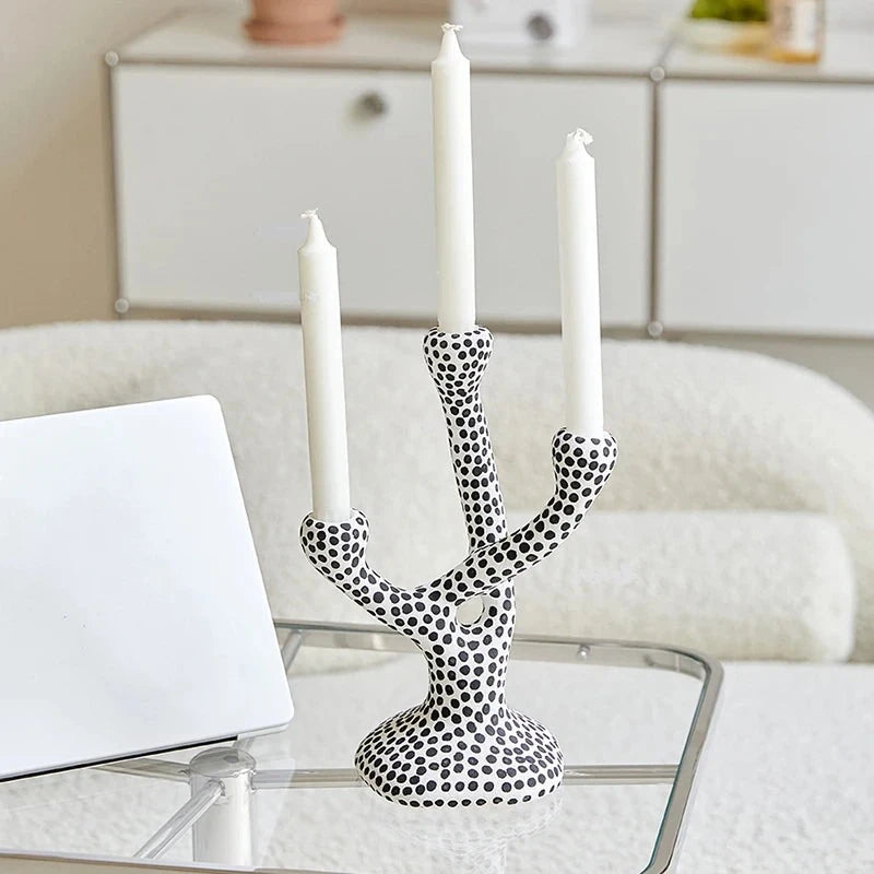 Whimsical Polka Dot Ceramic Candelabra by Allthingscurated combines abstract design with a touch of quirkiness, making it an aesthetically-pleasing piece for any modern and stylish homes. Perfect for lighting up your space with a touch of charm and personality; or as a decorative piece on its own.