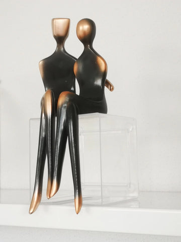 These pair of Abstract Couple Figurines has a modern and sleek design featuring a loving couple in embrace. It adds a touch of modern elegance to your space and looks sophisticated in their gradient black and bronze colors. Makes for a beautiful table tabletop decoration and perfect as a wedding or Valentine’s Day gift.