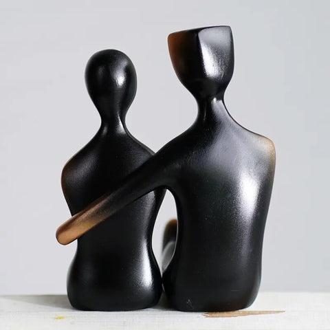 These pair of Abstract Couple Figurines has a modern and sleek design featuring a loving couple in embrace. It adds a touch of modern elegance to your space and looks sophisticated in their gradient black and bronze colors. Makes for a beautiful table tabletop decoration and perfect as a wedding or Valentine’s Day gift.