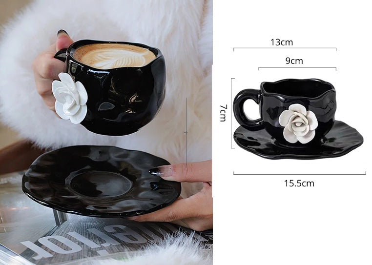 This Camellia Porcelain Cup Set / Mug by Allthingscurated features a single, significant bloom in a timeless black and white design that exudes sophistication. Its high fashion appeal makes it a perfect gift or impressive addition to your high-tea gatherings. Available as a mug or a cup set.