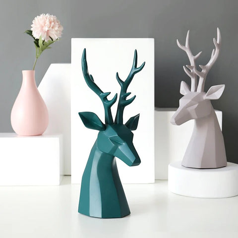 This beautiful Deer Head Bust sculpture is made of resin and comes available in 4 colors of black, white, gray and teal.  Measuring 26cm or 10 inches in height and 11.5cm or 4.5 inches in width. This figurine spots a contemporary design with sculptural form inspired by Origami. This decorative piece will add timeless elegance to your space year-round. Perfect for festive tablescapes, mantels and shelves. 