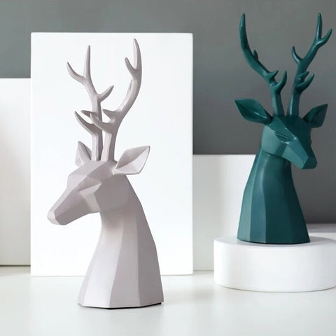 This beautiful Deer Head Bust sculpture is made of resin and comes available in 4 colors of black, white, gray and teal.  Measuring 26cm or 10 inches in height and 11.5cm or 4.5 inches in width. This figurine spots a contemporary design with sculptural form inspired by Origami. This decorative piece will add timeless elegance to your space year-round. Perfect for festive tablescapes, mantels and shelves. 