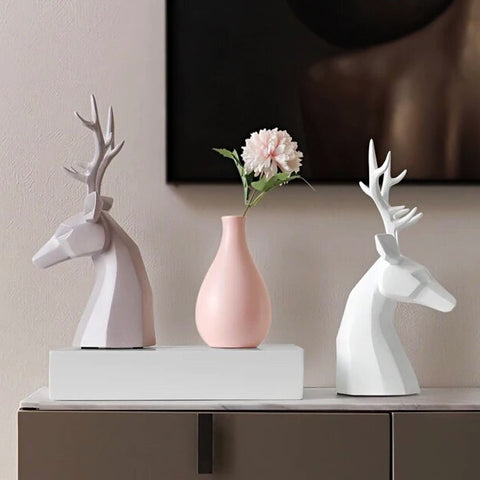 This beautiful Deer Head Bust sculpture is made of resin and comes available in 4 colors of black, white, gray and teal.  Measuring 26cm or 10 inches in height and 11.5cm or 4.5 inches in width. This figurine spots a contemporary design with sculptural form inspired by Origami. This decorative piece will add timeless elegance to your space year-round. Perfect for festive tablescapes, mantels and shelves. 