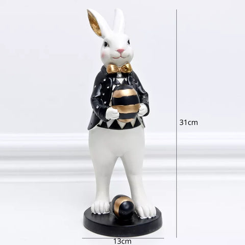 Our Regal Rabbit Family Figurines by Allthingscurated are beautifully-crafted and decorative. Made high-quality resin, these unique figurines will add a touch of elegance and whimsy to your home décor. Available in 6 designs, they are the perfect additions to your spring and Easter decorations. Featured here is Egg Holding Rabbit.