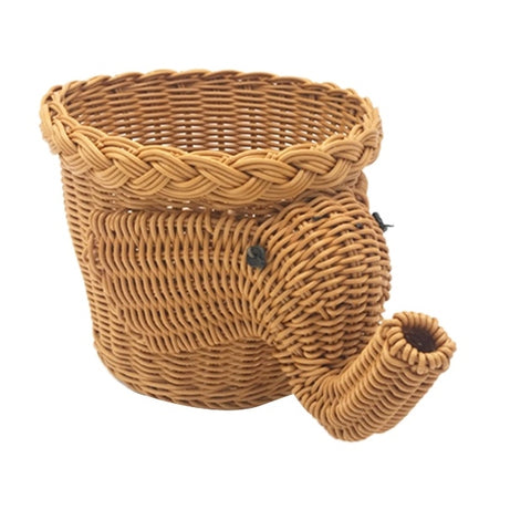 Allthingscurated elephant shape rattan basket in dark caramel color. Measuring height 16cm, diameter 20cm and width 30cm. Ideal as a storage basket or as a pot holder for your houseplant.
