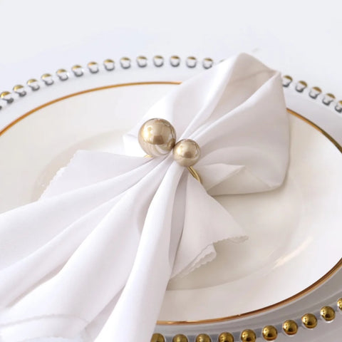 Faux Pearls Napkin Rings in a set of 6 by Allthingscurated are adorned with big and small pearls to create an overall look of elegance and sophistication.  They are perfect for special occasions. Come available in 4 different color combinations.