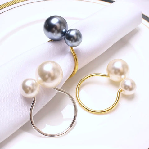 Faux Pearls Napkin Rings in a set of 6 by Allthingscurated are adorned with big and small pearls to create an overall look of elegance and sophistication.  They are perfect for special occasions. Come available in 4 different color combinations.