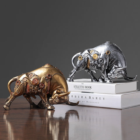 Futurox bull sculpture by Allthingscurated is the embodiment of steampunk aesthetics and futuristic mechanics. This exquisite masterpiece combines the grace and strength of a bull with the intricate beauty of gears. Standing at a height of 13.5cm or 5.3 inches, with length of 22.5cm or 8.8 inches and depth of 10.5cm or 4.1 inches. Its captivating presence will effortlessly elevate any space. Comes in gold and silver.