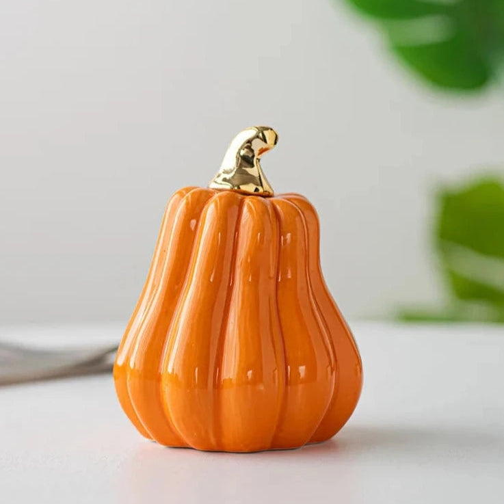 Glazed Ceramic Pumpkins by Allthingscurated spot a sculptural design that are perfect for adding a chic and stylish touch to your Halloween and Thanksgiving celebrations. Available in two designs in orange or white, let these ornamental pumpkins transform your home into a cozy autumn oasis.