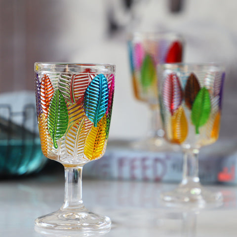 Havana Embossed Leaves Vintage Goblets by Allthingscurated, featuring contrasting multi-colored leaves embossed onto lead-free glass vessel. Charming with a touch of vintage vibe.