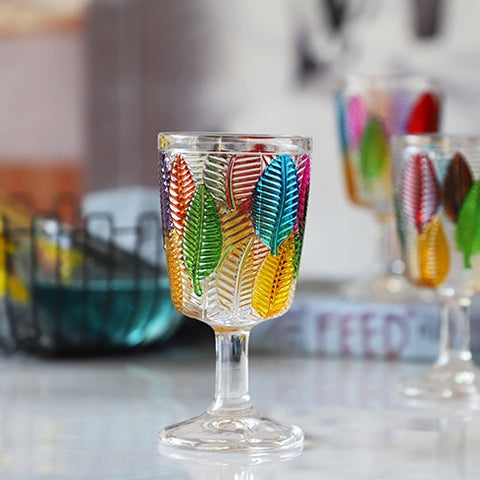 Havana Embossed Leaves Vintage Goblets by Allthingscurated, featuring contrasting multi-colored leaves embossed onto lead-free glass vessel. Charming with a touch of vintage vibe.