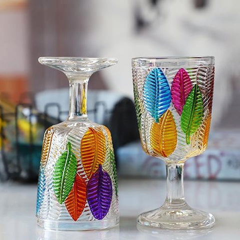 Havana Embossed Leaves Vintage Goblets by Allthingscurated, featuring contrasting multi-colored leaves embossed onto lead-free glass vessel. Charming with a touch of vintage vibe.