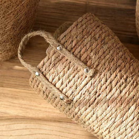 Hayden Tall Planters by Allthingscurated come in 3 sizes. Hand-woven using natural seagrass and comes with handles for easy transportation.