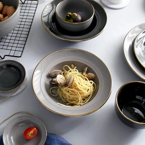 Kovan Ceramic Pasta/Soup Bowl by Allthingscurated is a stylish and functional bowl that offers versatility and practicality in usage. Perfectly sized for pasta, soups, stews, desserts and more. It’s a must-have addition to your dinnerware collection for all occasions from formal dining to everyday casual meals. Comes in gray and black.