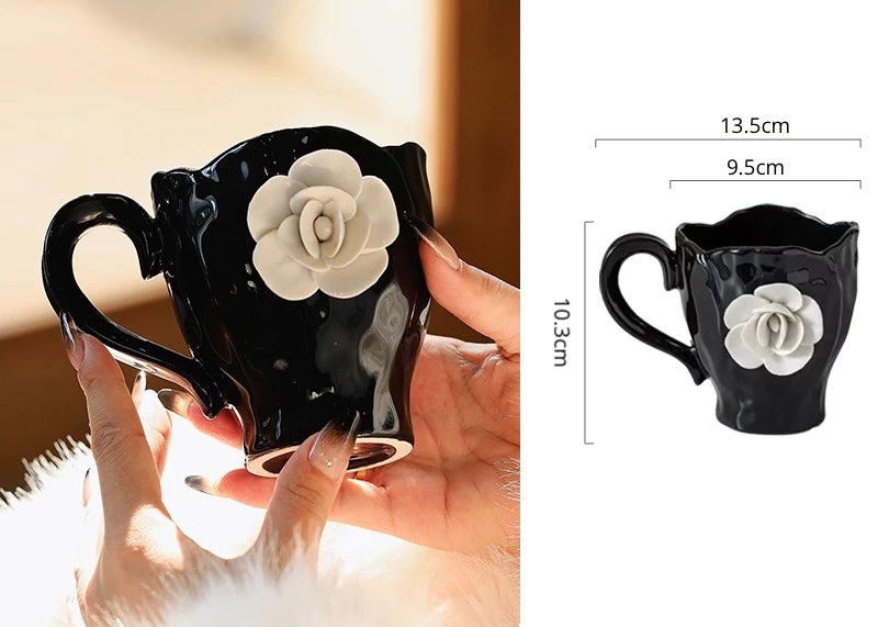 This Camellia Porcelain Cup Set / Mug by Allthingscurated features a single, significant bloom in a timeless black and white design that exudes sophistication. Its high fashion appeal makes it a perfect gift or impressive addition to your high-tea gatherings. Available as a mug or a cup set.