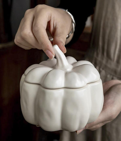 Lidded Stoneware Pumpkin Bowl by Allthingscurated features a sculptural pumpkin design.  It has a matte glaze finish in creamy white. Holds a capacity of 450mil or 15 ounce. Oozing with autumnal charm, it's the perfect serving bowl for all your thanksgiving, halloween and fall feasts.