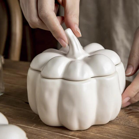 Lidded Stoneware Pumpkin Bowl by Allthingscurated features a sculptural pumpkin design.  It has a matte glaze finish in creamy white. Holds a capacity of 450mil or 15 ounce. Oozing with autumnal charm, it's the perfect serving bowl for all your thanksgiving, halloween and fall feasts.