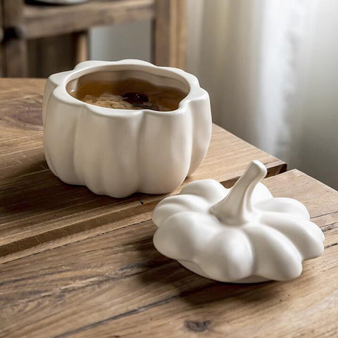 Lidded Stoneware Pumpkin Bowl by Allthingscurated features a sculptural pumpkin design.  It has a matte glaze finish in creamy white. Holds a capacity of 450mil or 15 ounce. Oozing with autumnal charm, it's the perfect serving bowl for all your thanksgiving, halloween and fall feasts.