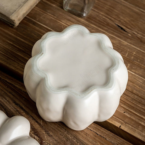 Lidded Stoneware Pumpkin Bowl by Allthingscurated features a sculptural pumpkin design.  It has a matte glaze finish in creamy white. Holds a capacity of 450mil or 15 ounce. Oozing with autumnal charm, it's the perfect serving bowl for all your thanksgiving, halloween and fall feasts.