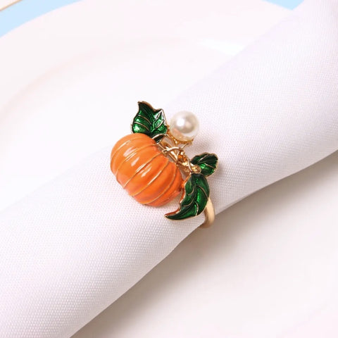 Faux Pearl Pumpkin Rings by Allthingscurated come in a set of 6 napkin rings. Each ring is crafted with exquisite detail of a pumpkin design and adorned with a faux pearl to bring a touch of sophistication. Perfect for all fall festivities, from Halloween to Thanksgiving.