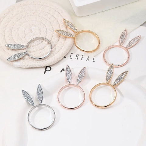 These sparkling Bunny Ear Napkin Rings (set of 6) by Allthingscurated add a cute and whimsical touch to your Easter table setting. Made of metal and encrusted with rhinestones, they come in gold, silver, and rose gold. Elevate your dining experience with these charming and sparkly napkin rings.