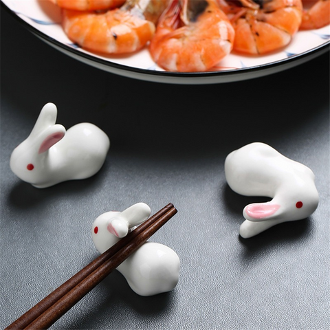 Enhance your Asian dining experience with our Ceramic Rabbit Chopstick Rests by Allthingscurated. These pieces will bring a playful edge to your table with their ability to keep your chopsticks clean and secure. Comes in a set of 3 or 6 pieces.