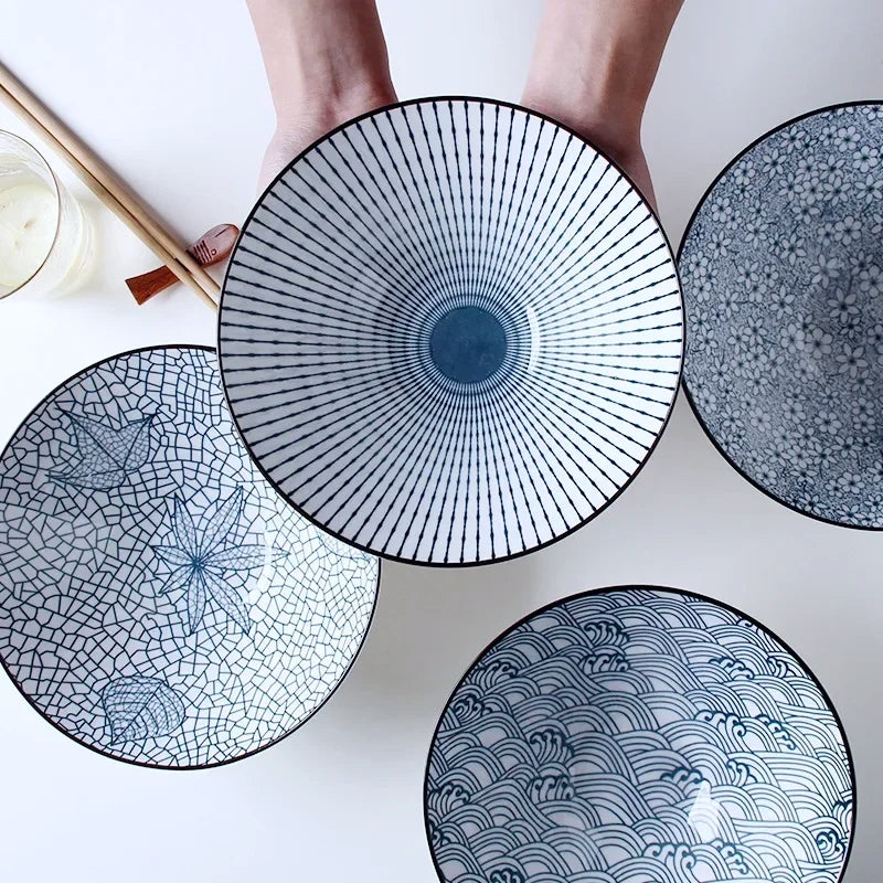 This Blue and White Japanese Ramen Bowls by Allthingscurated feature a modern, Asian design in a conical shape with a white fluted exterior, the porcelain bowls spot a beautiful, Japanese-inspired print for the interior. Comes in 4 different designs, this versatile bowl is not just for ramen, but also great for soups, curries and salads.