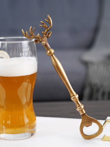 Brass Reindeer Bottle Opener by Allthingscurated.  Crafted from brass and designed with a long handle and an ornamental reindeer head—it is an eye-catching bar tool and charming accessory for Christmas and beyond.