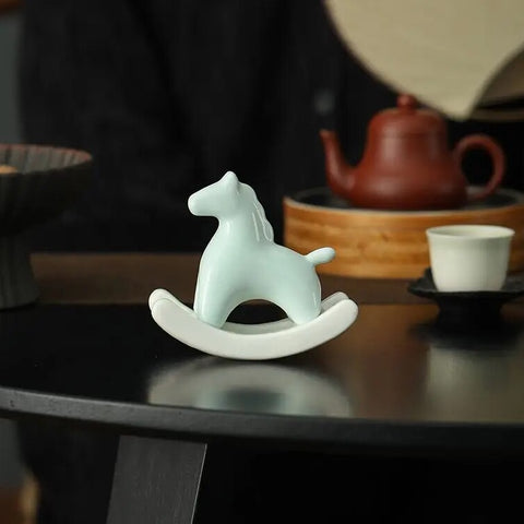 This Petite Ceramic Rocking Horse by Allthingscurated is a work of art. Crafted by hand from ceramic and decorated with a beautiful crackle pattern, it exudes a subtle far-eastern beauty and grace. Makes a perfect gift for those who appreciate quality craftsmanship and a treasured gift to any horse collector. Comes in green and azurerish white. Measures 9.8cm or 3.8 inches in height, 10.4cm or 4 inches in width and 4.2cm or 1.6 inches in depth.