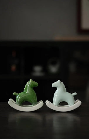 This Petite Ceramic Rocking Horse by Allthingscurated is a work of art. Crafted by hand from ceramic and decorated with a beautiful crackle pattern, it exudes a subtle far-eastern beauty and grace. Makes a perfect gift for those who appreciate quality craftsmanship and a treasured gift to any horse collector. Comes in green and azurerish white. Measures 9.8cm or 3.8 inches in height, 10.4cm or 4 inches in width and 4.2cm or 1.6 inches in depth.