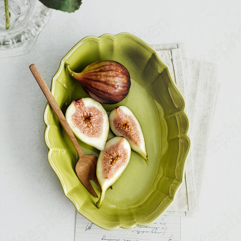 French Style Ruffle Edge Dish by Allthingscurated are oval shallow serving dishes featuring a ruffle edge with curved rims. Come in 3 colors of white, green and brown and in 2 sizes.