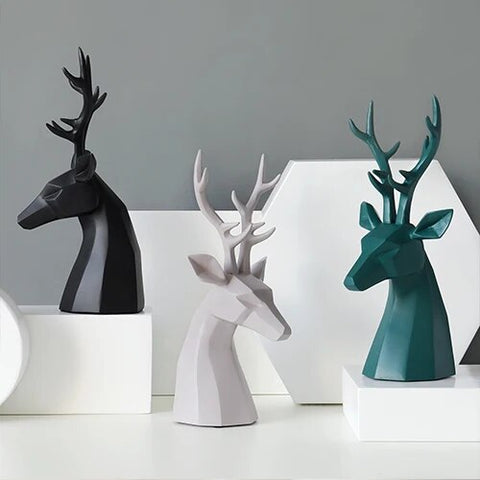 This beautiful Deer Head Bust sculpture is made of resin and comes available in 4 colors of black, white, gray and teal.  Measuring 26cm or 10 inches in height and 11.5cm or 4.5 inches in width. This figurine spots a contemporary design with sculptural form inspired by Origami. This decorative piece will add timeless elegance to your space year-round. Perfect for festive tablescapes, mantels and shelves. 