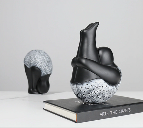 Roly-Poly-Dolly Yoga Figurines by Allthingscurated. Crafted from resin and featuring stylized volumetric figures that are characteristically rotund in shape and flexible, these artfully-designed unique pieces feature timeless black and white female figures in yoga poses.  Available in 2 styles of poses, Standing Forwarding Bend and Sitting Forward Bend.