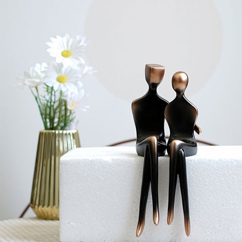 These pair of Abstract Couple Figurines has a modern and sleek design featuring a loving couple in embrace. It adds a touch of modern elegance to your space and looks sophisticated in their gradient black and bronze colors. Makes for a beautiful table tabletop decoration and perfect as a wedding or Valentine’s Day gift.