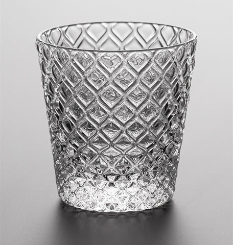 Carven geometric glass tumblers by Allthingscurated spots a unique design resembling the exterior of a pineapple.  An elegant and charming drinkware for serving cocktails, whiskey and sangria to you guests. Come available in clear or iridescent glass with height measuring 7.6cm or 3 inches by top diameter of 7.3cm or 2.8 inches and base diameter of 5.2cm or 2 inches. This is a clear tumbler.
