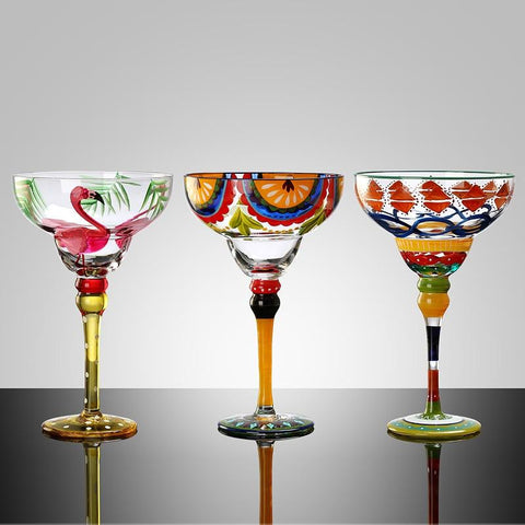 Ibiza Party Cocktail Glasses by Allthingscurated are available in 7 eclectic designs. Each cup is hand-painted and hand drawn to reflect its individual personality and creativity.