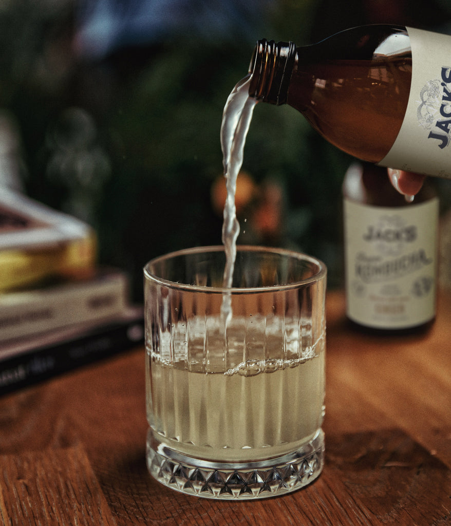 Pouring a glass of delicious Jack's Kombucha