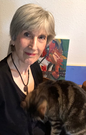 Laura Hunt, artist, in her studio with her cat Ginsburg