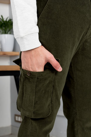 Premium Photo  Hand grabs corduroy trousers on sale shopping