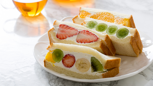 Four slices of Japanese fruit sandwiches on a plate