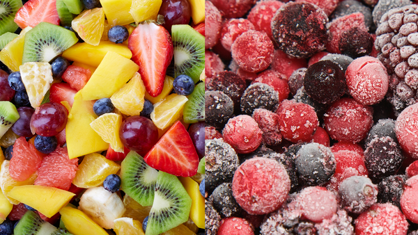 Fresh fruits on the left while frozen berries on the right