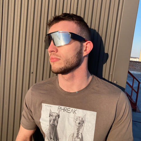 man wearing wrap around sunglasses