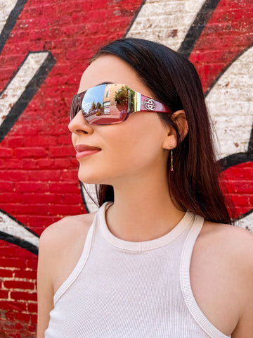 woman wearing pink shield sunglasses
