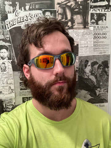 man wearing mirrored wrap around sunglasses