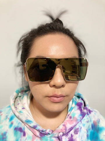 woman wearing mirrored shield sunglasses