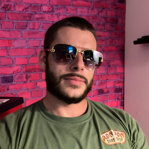 man wearing gold aviator sunglasses