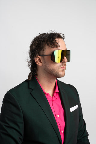 man in green suit wearing mirrored shield sunglasses