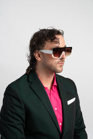man wearing green suit and brown futuristic square sunglasses