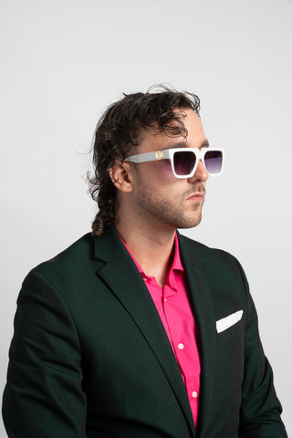 man wearing green suit and white square sunglasses